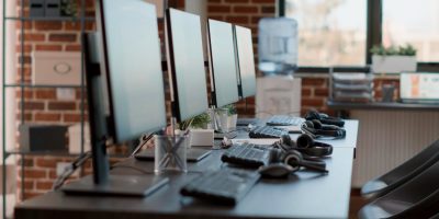 nobody-empty-call-center-workstation-with-computers-audio-instruments-no-people-customer-service-office-desks-with-telecommunications-technology-offering-helpline-assistance